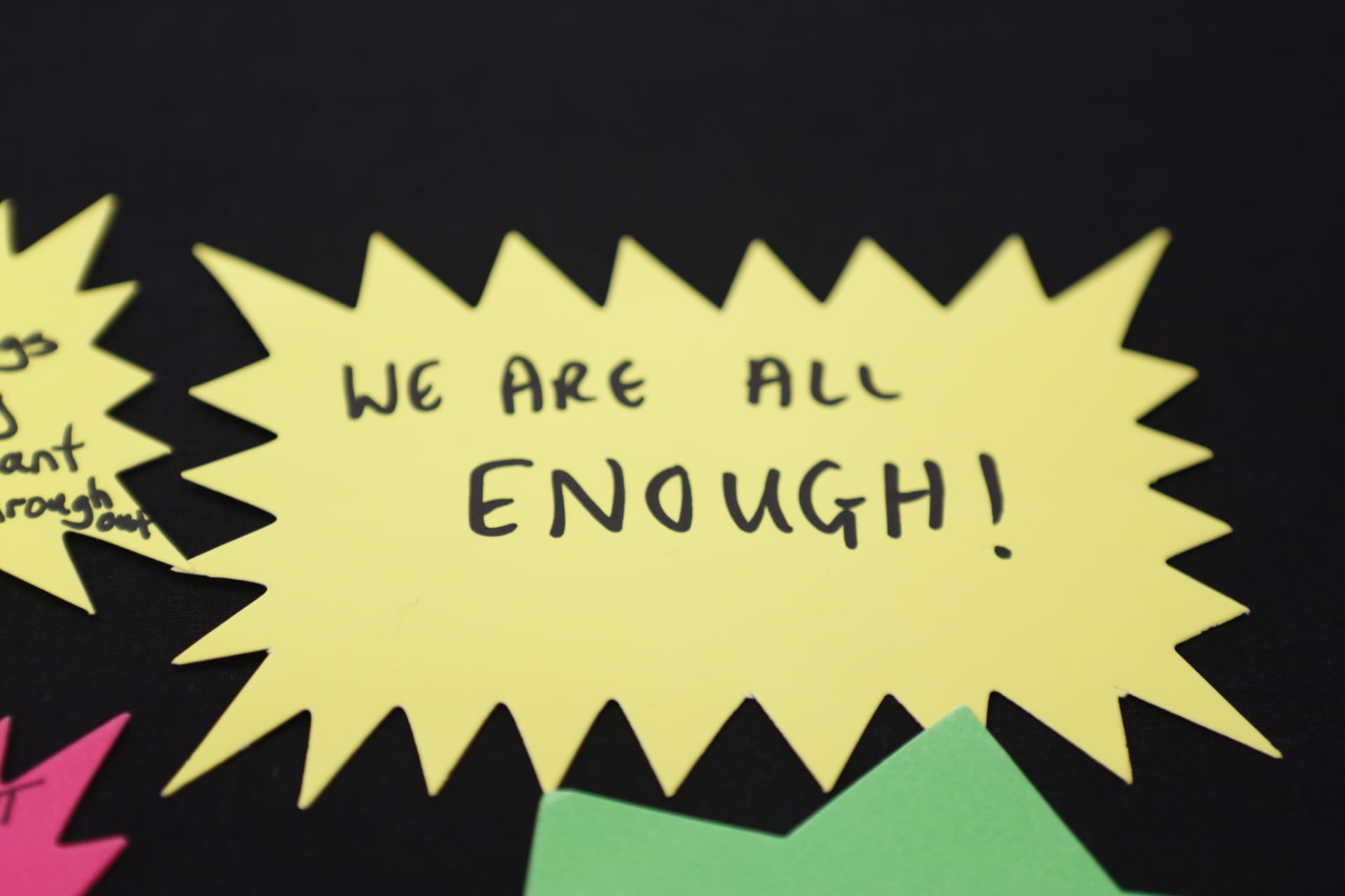 A handwritten note from an attendee reading: we are all enough.